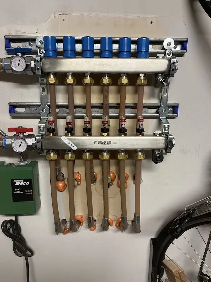 Plumber performing Water Heater Repair at a residential property in Buffalo